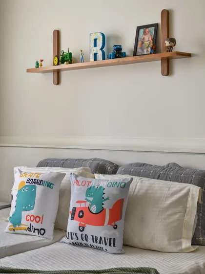 We designed this simple, elegant floating ledge for a kid's room to hold books and toys, adding both function and charm above the headboard.