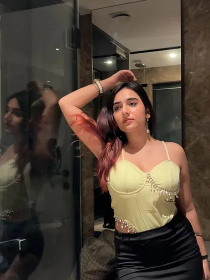 A confident pose in the corset, highlighting its flattering silhouette. I aim to make my followers feel empowered through the fashion I showcase.