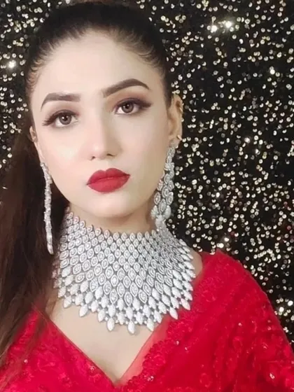 A close-up of the model wearing the wide American Diamond choker, showing how it catches the light against the sparkling background.