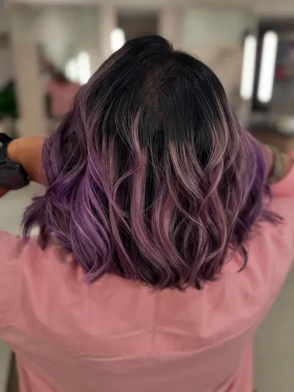 The back view of this lilac balayage shows how the color melts from the natural dark root.