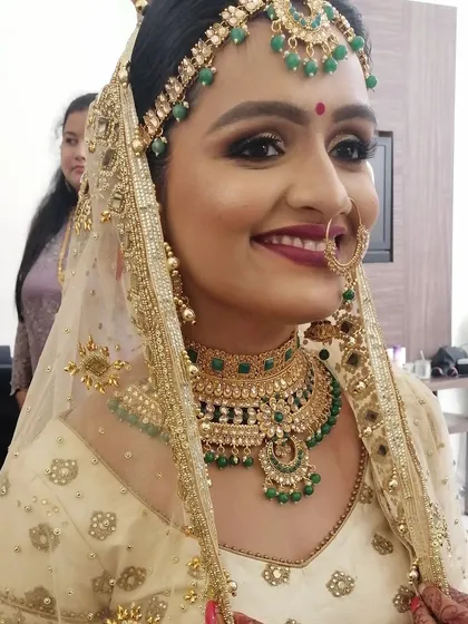 The final bridal look. A radiant and happy bride, showcasing a flawless makeup application that looks stunning both up close and from a distance.