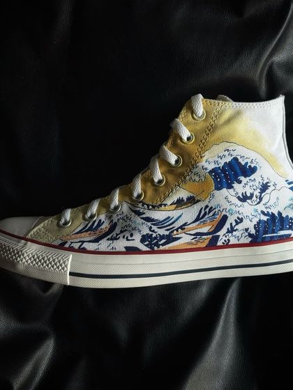 A side profile of "The Great Wave" custom sneaker.