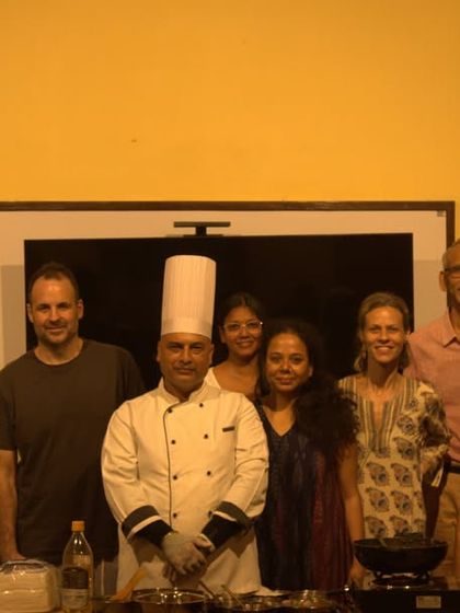 A group photo of our guests and staff after a successful Ayurvedic cooking session. We believe in sharing the knowledge of healing cuisine so you can continue your wellness journey at home.