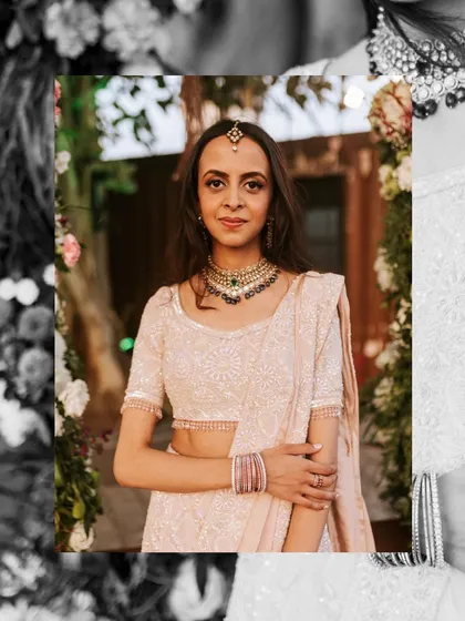 A stunning portrait of the bride on her ring ceremony day. The creative framing and monochrome elements highlight her elegant look and traditional jewelry.