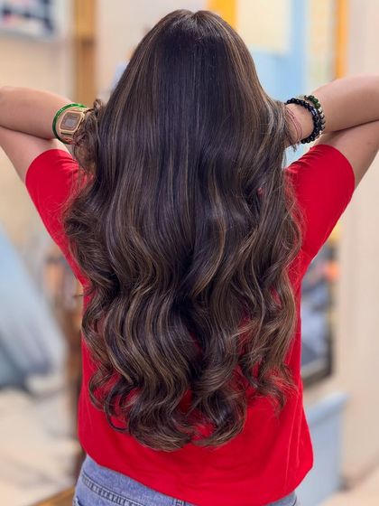 Our Toffee hair color obsession continues. These images display the rich, warm tones and seamless blending of our custom toffee shade on long, wavy hair.