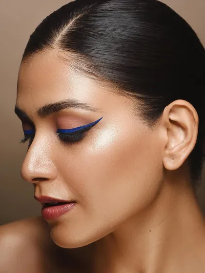 A profile view offers a different perspective in a beauty series. This shot emphasizes the elegant shape of the winged eyeliner and the model's facial structure, showing how different angles can tell a different story.