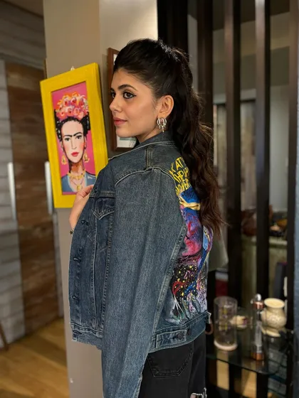 A side-profile view of the half-up ponytail I created for Sanjana Sanghi. This angle shows the volume and texture of the waves, creating a look that is both casual and put-together.