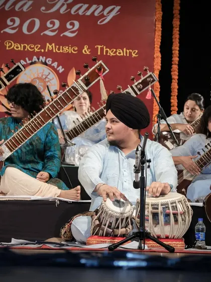 Looking towards the lead artist, Pt. Ravi Chary ji, for cues. This constant interaction is key to a tight performance.