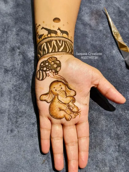 Another angle of the baby elephant design, showing the delicate line work and shading before the final details are added.