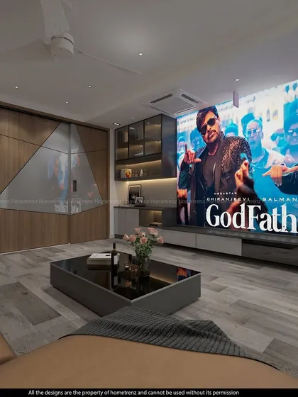 The large screen displaying a movie, showcasing the immersive experience of a well-designed home theatre.