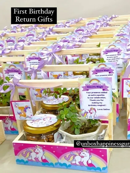 A large array of unicorn-themed third birthday return gifts, showcasing the beautiful pink and lavender color scheme.