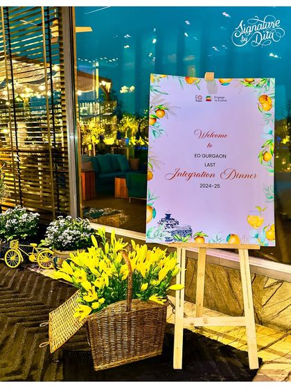 The welcome easel for the EO Gurgaon Integration Dinner, featuring a custom lemon-themed design. This sign, paired with fresh yellow flowers, immediately introduced the Sicilian "La Dolce Vita" theme.