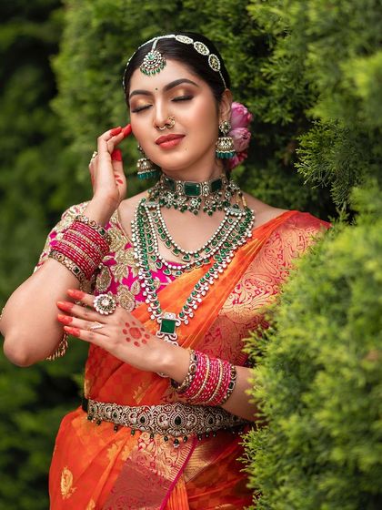A serene bridal portrait taken outdoors. The bride's calm expression and the soft natural light create a peaceful and elegant image.
