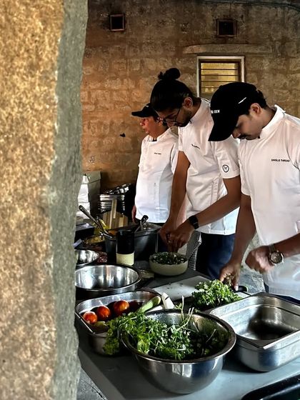 My team prepping fresh ingredients at an outdoor event, showcasing our ability to set up a functional kitchen anywhere.