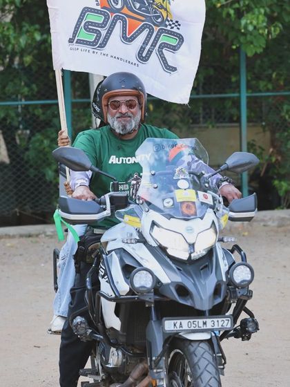 A proud BMR member on his BMW GS, flying the club flag high during the World Motorcycle Day 2024 ride. This represents the pride and passion every member has for our club.