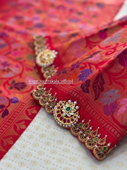 A close-up of the sleeve cuff, where each stone is carefully set within the zardosi work.