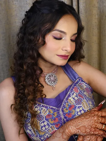 Another angle of the Haldi look, with the model's eyes closed to highlight the detailed eye makeup.