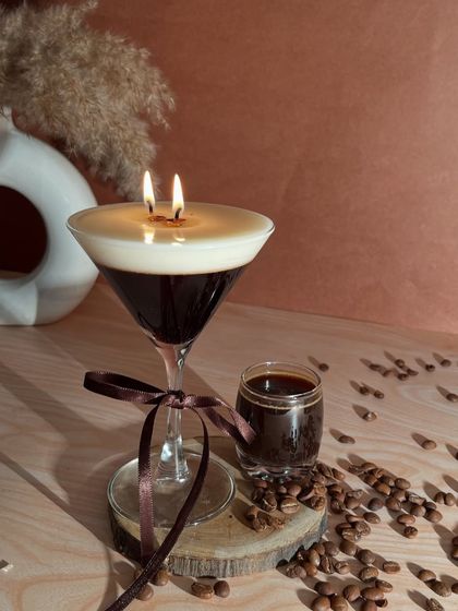 My Espresso Martini candle is for those who love a rich kick. It's designed in a martini glass with a frothy top and coffee bean embeds.