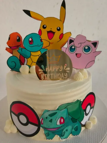 Gotta catch 'em all! A fun Pokemon themed cake with Pikachu, Bulbasaur, Charmander, and other favorite characters.