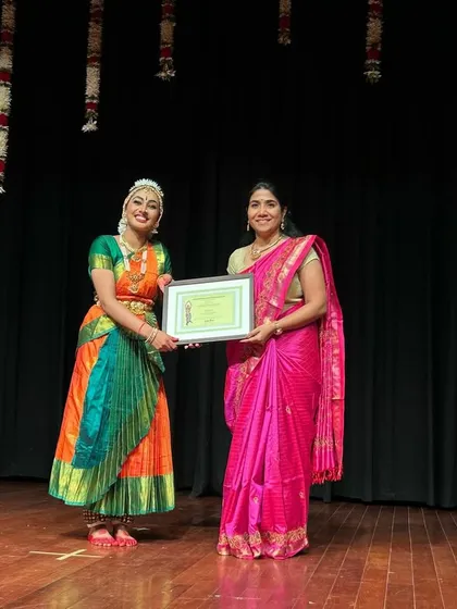 A moment of pride for both the Guru and Sishya. This photograph captures the beautiful bond that is forged through years of shared hard work and dedication to the art of Bharatanatyam.
