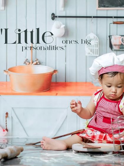 Little ones, big personalities. A little chef is busy exploring the props in our detailed kitchen studio.
