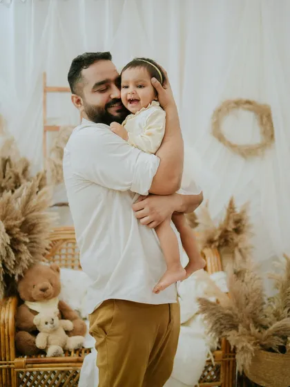A father's gentle embrace. This photo beautifully captures the strong and loving bond between a dad and his daughter.
