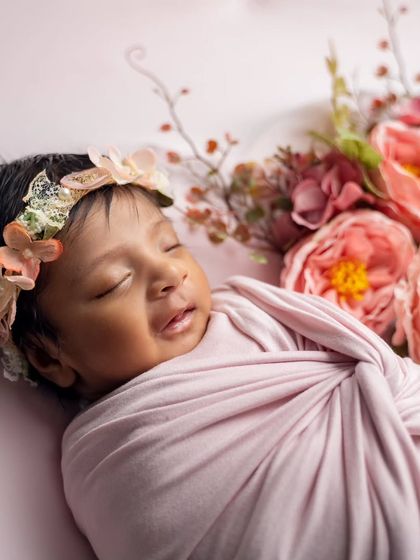 A sweet smile in her sleep. We are always ready to capture these fleeting, precious expressions that happen in a blink of an eye.
