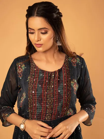 A classic portrait showing the detail of the embroidered top.