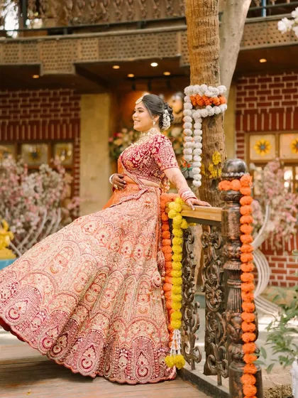 A candid shot of the bride enjoying her wedding day. The makeup is designed to be long-lasting and comfortable, allowing her to be fully present in every moment.