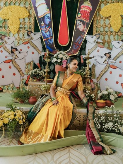 The final look, with the bride seated amidst a backdrop inspired by traditional Telugu art, embodying the grace of Goddess Lakshmi.