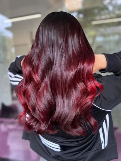 Another angle of the cozy red balayage, showing the beautiful waves and color gradient.