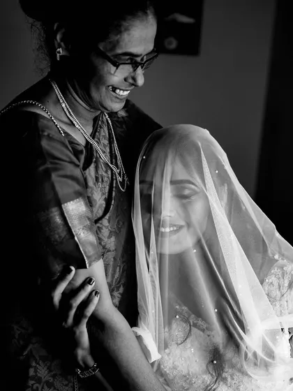 A priceless, candid moment between the bride and her mother. Capturing these loving family interactions is a cherished part of the wedding story.