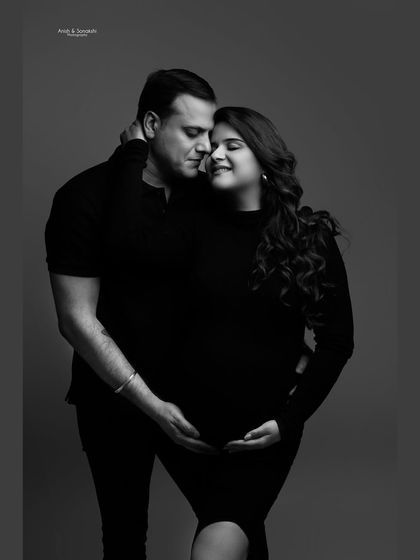 The same loving moment, captured in timeless black and white. Monochrome photography often brings out the raw emotion and connection in a portrait, creating a truly artistic feel.