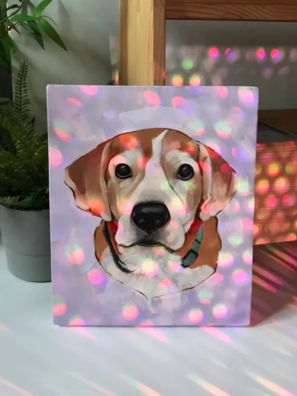 An artistic shot of the finished acrylic painting of Bruno, with some creative lighting effects. I love experimenting with how the finished canvas looks in different settings, highlighting the colors and textures of the paint.