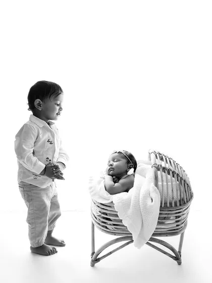 The same moment in timeless black and white, which adds another layer of emotion and nostalgia to this beautiful sibling portrait.