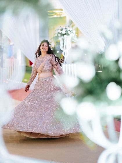 A happy bride enjoying her moment. The makeup is designed to look flawless even in action shots.