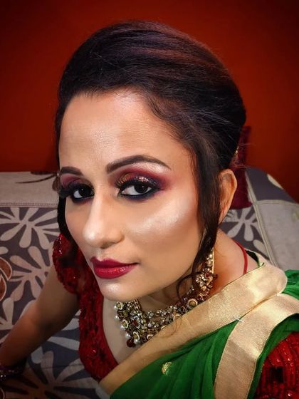 A striking portrait of the client, showcasing the artistic makeup.