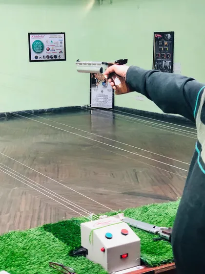 A close-up of a shooter taking aim. Our facility provides a clear line of sight to the targets, allowing you to focus completely on your shot.