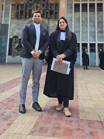 Posing with a colleague outside a court building. A strong professional network is essential for staying updated on legal precedents and strategies.