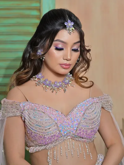 Another serene portrait, giving a clear view of the details on the floral choker.