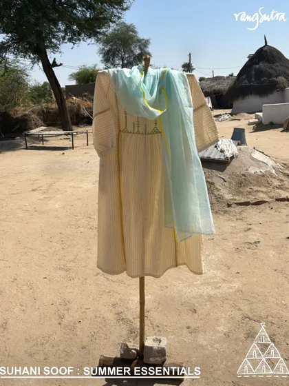Our Suhani Soof kurta, set against the backdrop of a desert village. This piece is a summer essential, made from light-as-air cotton and crafted slowly by the hands of desert artisans.