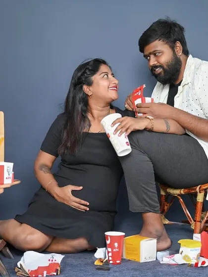 Sharing a fun moment with their favorite snacks, this maternity shoot is all about celebrating the couple's personality and their journey together.