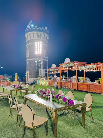 The elegant table settings at the scenic lighthouse venue, ready for guests to enjoy dinner under the stars.