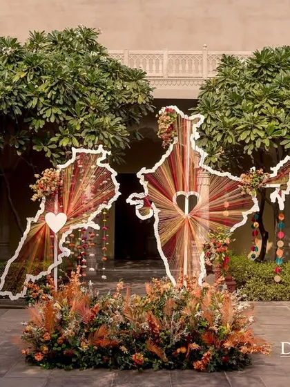 A custom installation featuring maps of India and Lebanon, connected by a heart. This piece, made of colorful threads, was the central symbol of a beautiful Indo-Lebanese union.
