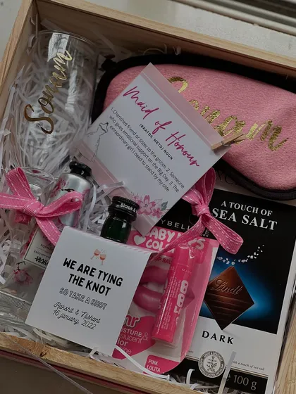 A "Maid of Honour" deserves something extra special. This hamper includes a personalized glass, a sleep mask, miniature drinks for a toast, and some chocolate, because planning a wedding is hard work.