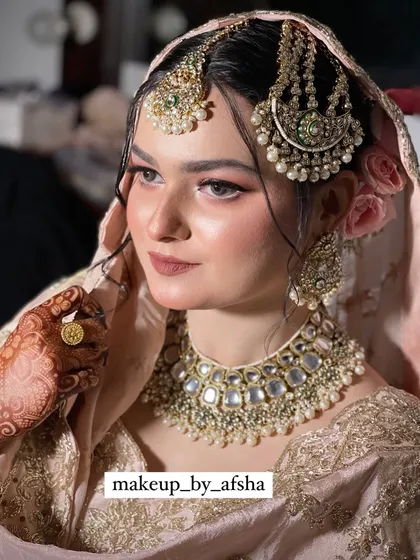 A stunning portrait of the bride, looking radiant and happy.