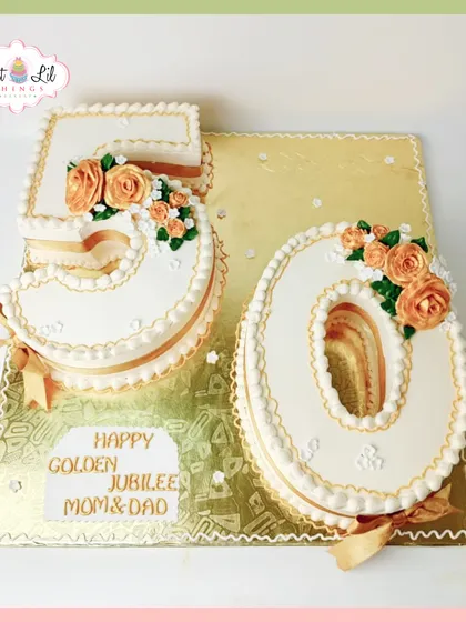 A classic and elegant number cake for a 50th golden jubilee anniversary. The "50" is beautifully piped and decorated with delicate orange roses.
