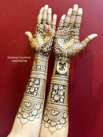 Created with love for a special client, this full-arm bridal design features intricate bands, peacock motifs, and a Ganesha figure for blessings.