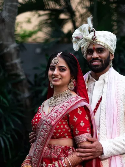 A classic portrait of a smiling couple in their wedding attire. This is a timeless shot that every family loves to have.