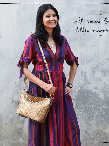 Our patron and model Tulika looking radiant with the All Woven Bronze Little Namrata. The metallic sheen of the bag is a perfect accessory.